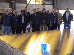 A perfectly polished ITER drain tank steel plate at Stainless Steel Services (USA) with a surface finish well below 1.6 micrometres. Alongside Giovanni Dell Orco, Thierry Jourdan and Babulal Gopalapillai from ITER are members of US-ITER, AREVA FS, Joseph Oats Corporation and Stainless Steel Services. (Click to view larger version...)